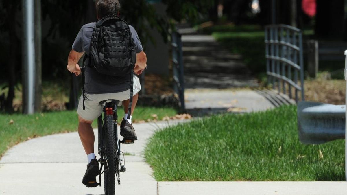 A bicyclist rides on the sidewalk along 43rd Street West, a roadway that does not have marked bike lanes. A sales tax referendum to pay for county infrastructure will be on November's ballot. The revenue will go toward transportation, public safety and law enforcement and parks and community facilities. An estimated $15.9 million would go toward improvements along 43rd Street West between 36th Avenue West to 9th Avenue West. The improvement is an upgrade to the current standards for travel lanes, sidewalks, bike lanes (or trail) and lighting.