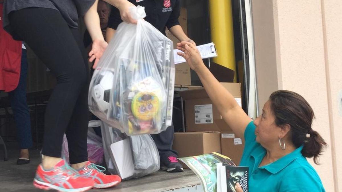 Salvation Army volunteers help to distribute enough toys to provide a very merry Christmas for 1,500 Manatee County children through the agency’s Adopt-A-Family program funded entirely by donations from the public.