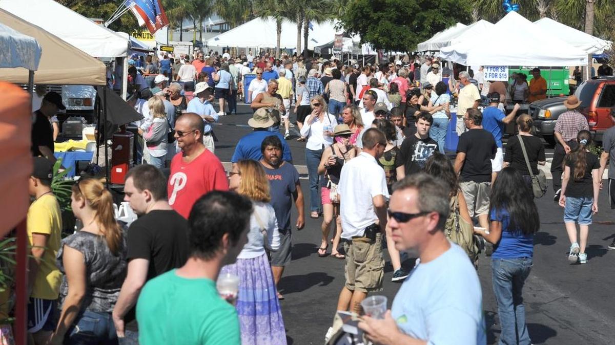 People pack the walkways at the 26th annual Taste of Manatee festival Saturday at Bradenton’s Riverwalk.
