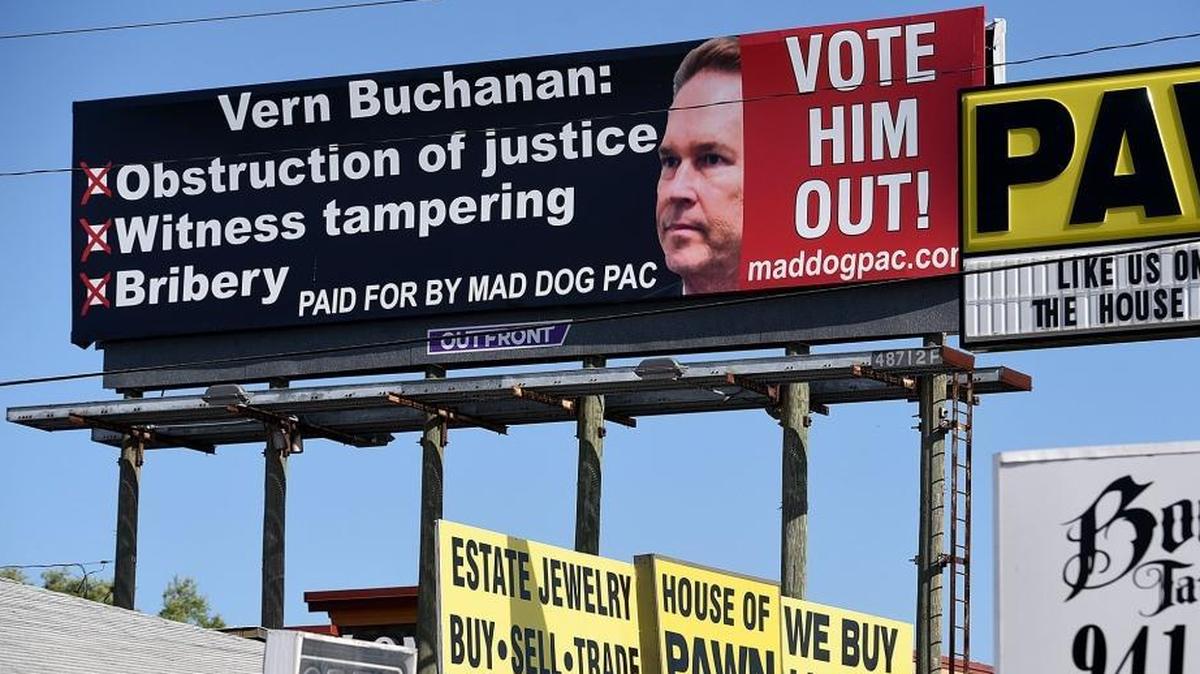 A billboard funded by Mad Dog PAC calls out Vern Buchanan.