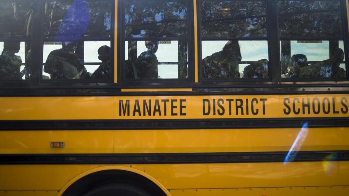Anna Maria Elementary students line up to exit a Manatee County school bus.