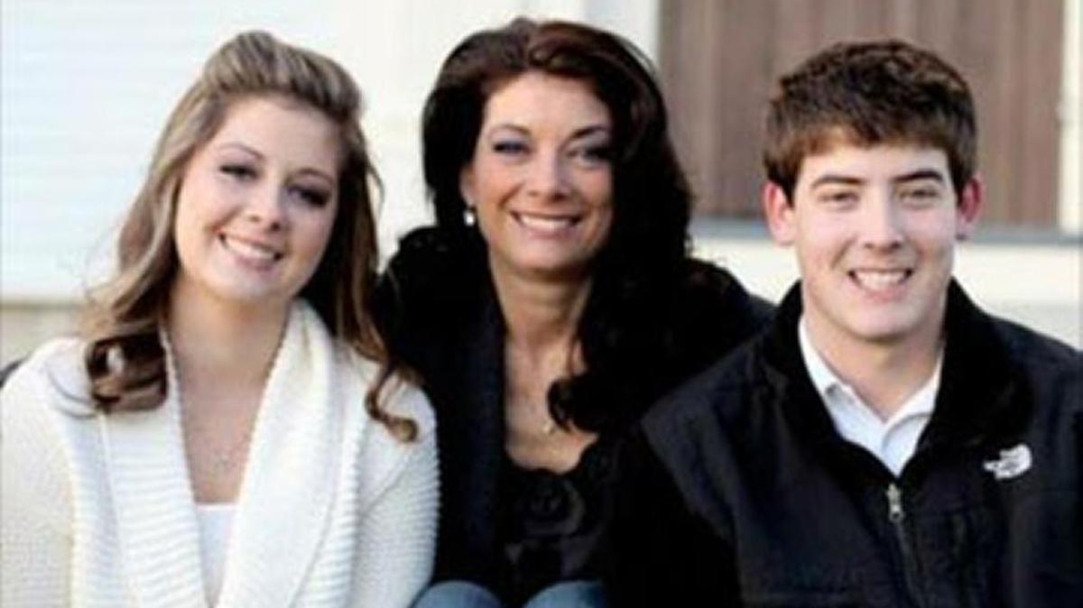Kelly DeWolf, center, is moving forward in life with her children, Lindsay, 27, left, and Jonathan, 25, right, 12 years after the death of her husband, firefighter Christopher DeWolf in the line of duty in New Hampshire. The DeWolfs, who are all currently in graduate schoool, live in Manatee County and New Hampshire and were all recently awarded a national college scholarship.