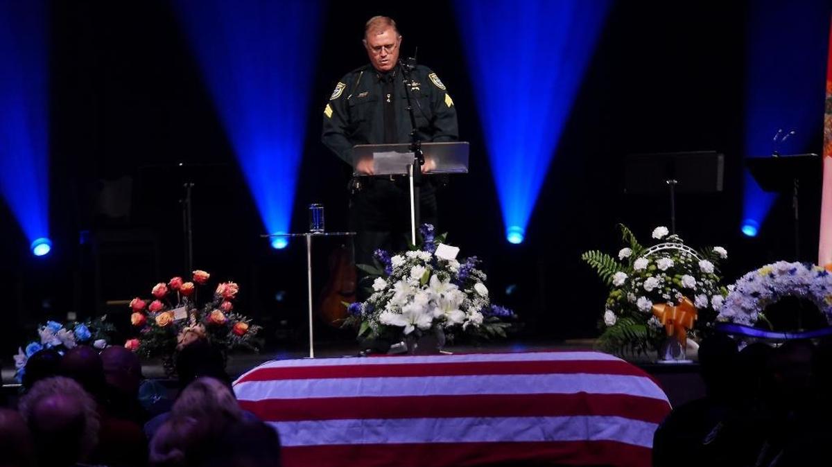 Deputy Danny O’Bryan of the Hardee County Sheriff’s Office speaks during a funeral service for Deputy Sheriff Julie Bridges on Saturday morning at Bayside Community Church in Bradenton.