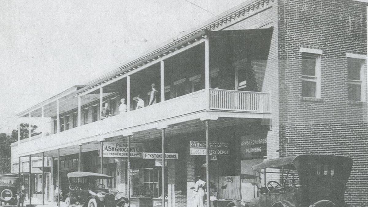 Businesses flourish in the Cummings Block brick buildings on Manatee Avenue shown on a postcard circa 1916.