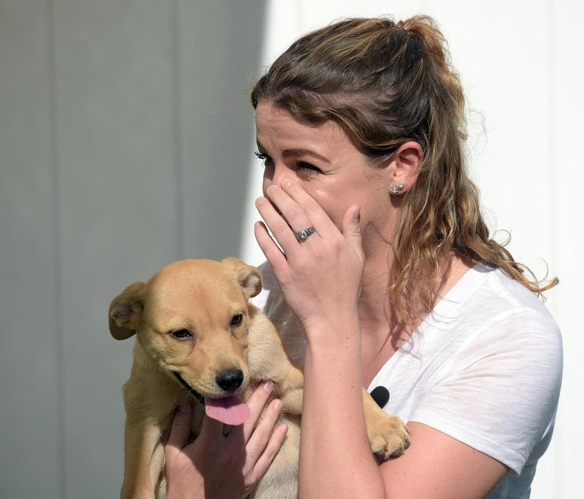 National Guardsman Bridget Burch came from New York to be reunited with the puppy she fell in love with while deployed in St. Croix after Hurricane Maria. Burch reunited with Dominica at Nate's Honor Rescue Wednesday.