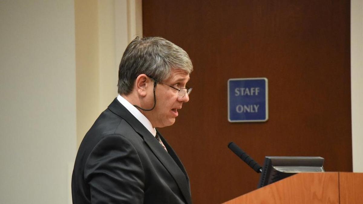Art Davis, senior vice president of Springsted Waters Executive Recruitment, reads the names of the candidates that Manatee County commissioners voted to bring in for interviews in September.