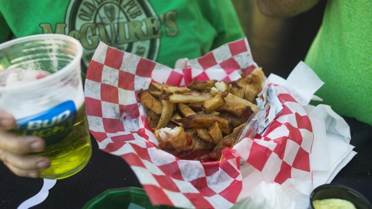 Kevin and Helen McGuire, of Sarasota, enjoy fish and chips from Pub 32 along with green beer during the sixth-annual Irish Celtic Festival on Saturday afternoon at Adventure Park in Lakewood Ranch’s Greenbrook Village.