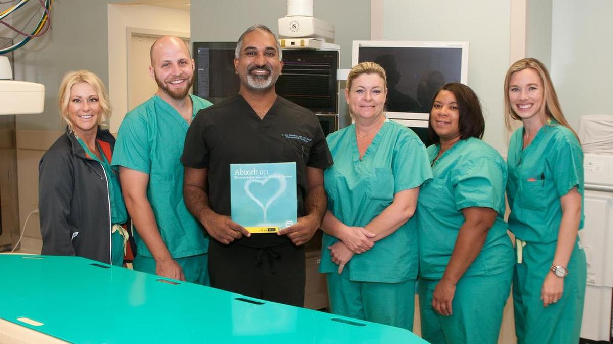 The team implanted the dissolving heart stent at Manatee Memorial Hospital on Wednesday included, from left: Brittany Cohill, senior territory manager of Abbott Vascular; Floyd Baker III, cardiovascular technician, Manatee Memorial; Dr. S. Jay Mathews, Bradenton Cardiology Center; Elizabeth Fjare, R.N., Manatee Memorial; Tara R. Read, certified radiologic technician, Manatee Memorial; and Megan Kelly, coronary field sales associate, Abbott Vascular.