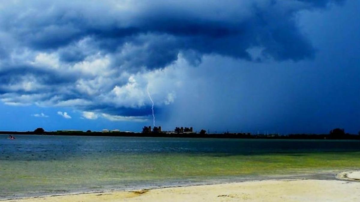 Lightning and clouds fill the sky over Gandy Beach in St. Petersburg.
