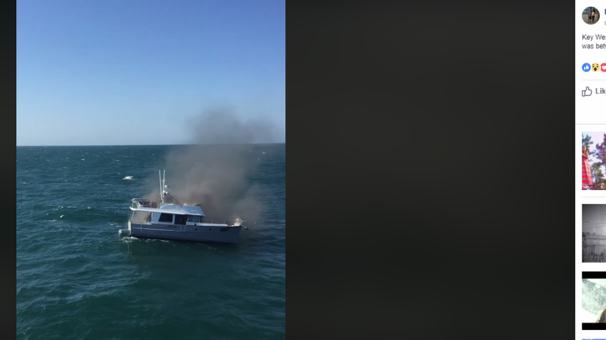 A video captured by a ferry passenger shows a Sarasota family swimming from their burning boat in the Gulf of Mexico on Monday.