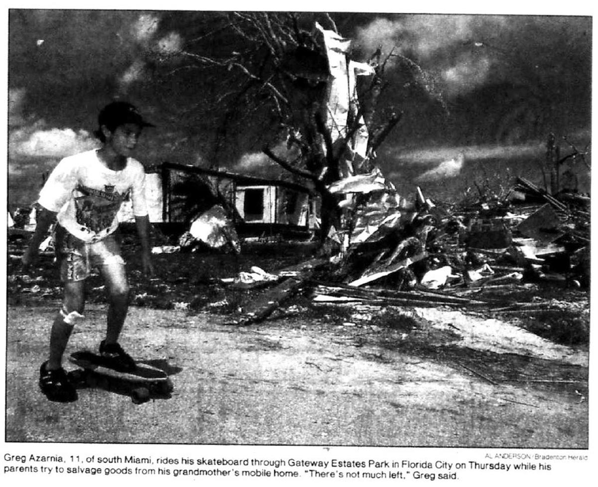 A boy rides his skateboard through Florida City days after Hurricane Andrew hit South Florida in 1992.