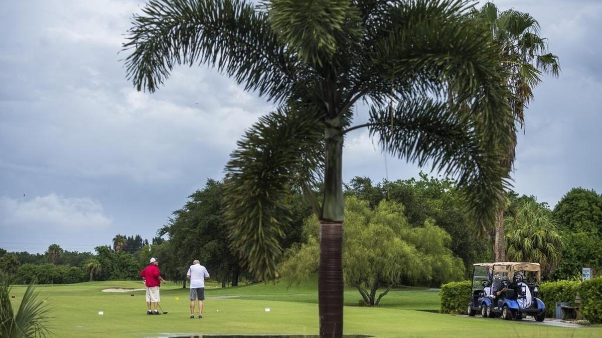 Golfers set up on the River Run Golf Course on a rainy Friday afternoon in Bradenton. Bradenton officials are debating the sustainability of the municipal golf course as profits continue to shrink.
