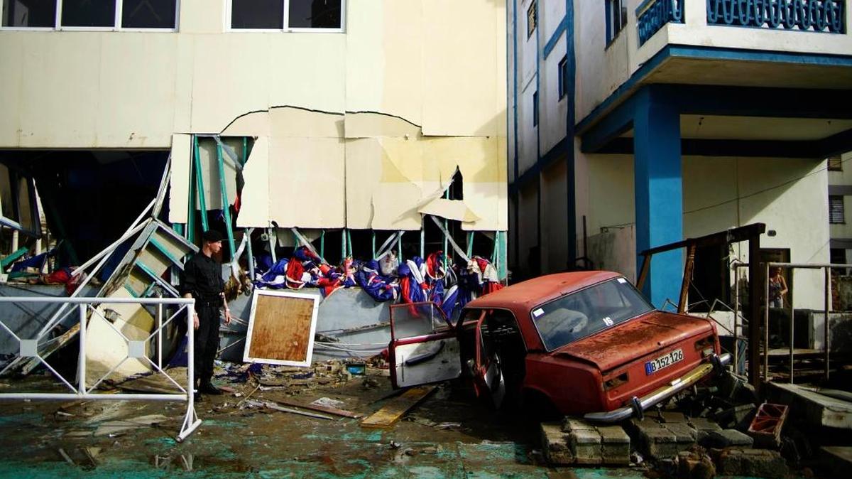 A vehicle lies embedded in the shattered Anti Imperialist Tribune building, after it was flung there by the force of Hurricane Irma, just a few meters from the United States Embassy building , in Havana, Cuba, Sunday, Sept. 10 2017. Powerful waves and storm surge from Hurricane Irma topped Havana's iconic Malecon seawall and left thousands of homes, businesses and hotels swamped, even as the storm moved away from the island. (AP Photo/Ramon Espinosa)