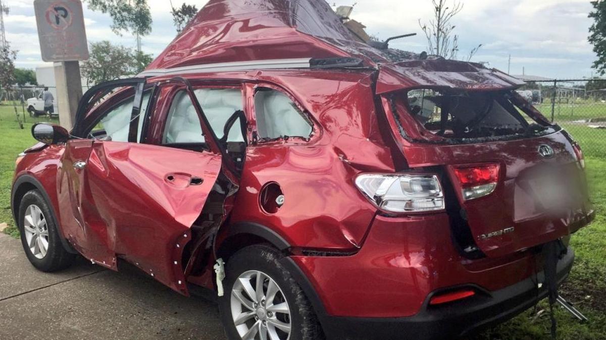 Two people were injured Sunday when the gas grill in their car exploded after a woman lit a cigarette.