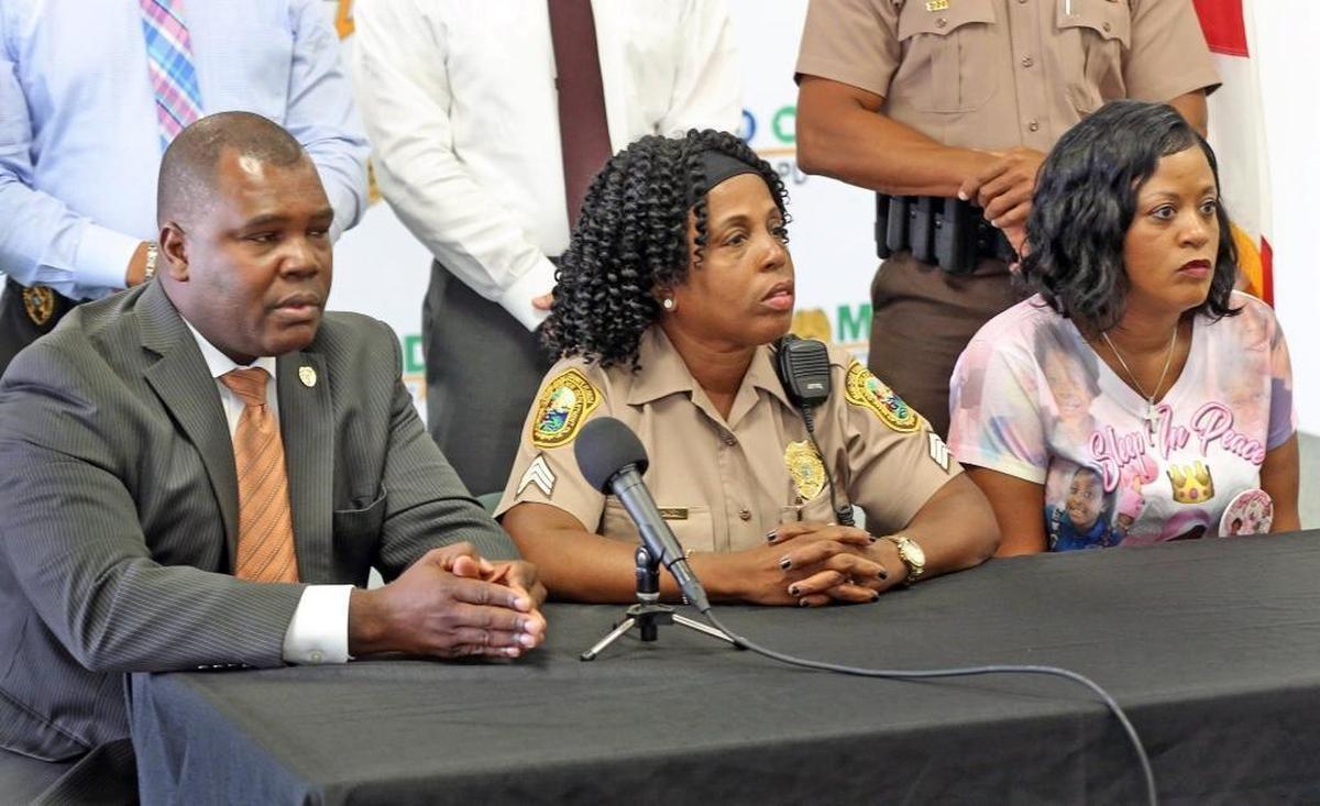 Miami-Dade Homicide Detective Maj. Calvin James, Miami-Dade Police Brendolyn Spence and Lisa Brown, grandmother of Jada Page, are asking the public for help in identifying the person responsible for the murder of the 8-year-old girl, Monday, August 28, 2017