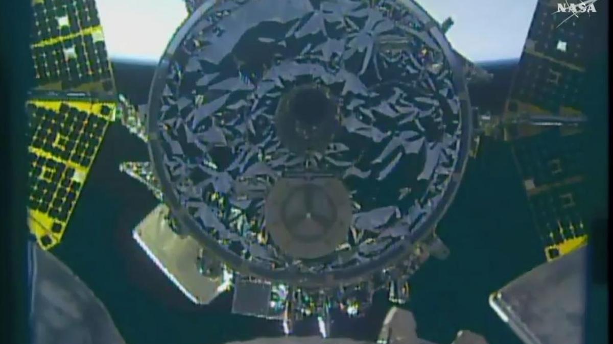 In this image made from video provided by NASA, the S.S. John Glenn cargo ship prepares to dock with the International Space Station on Saturday.