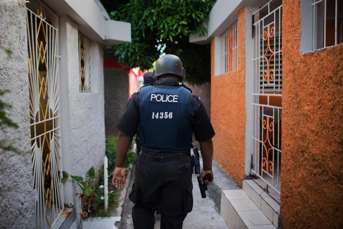 Members of the Mobile Reserve, an arm of the national police, patrol the neighborhood of Dunkirk in Kingston, Jamaica, June 6, 2013.
