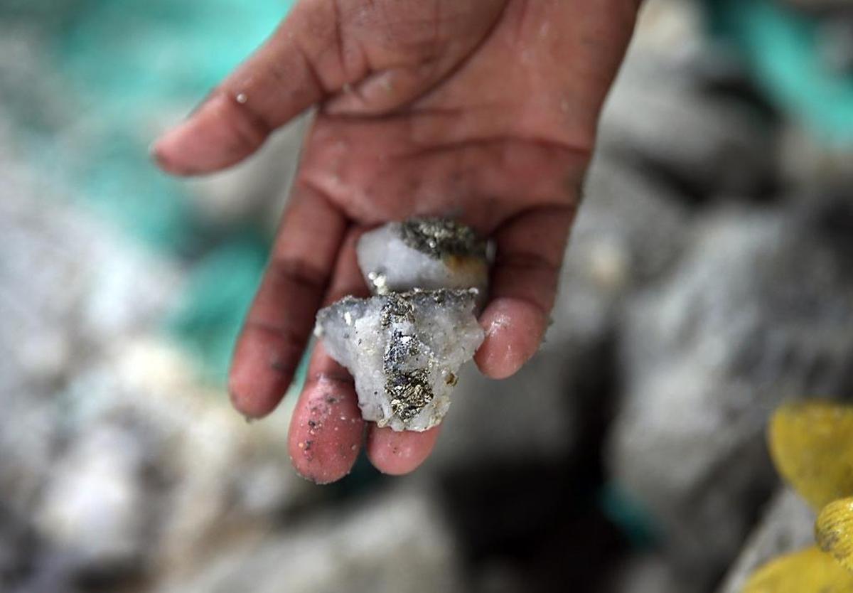 Doris Fonegra (part of a group of mostly women called chatarreras) displays a rock containing particles of gold extracted from Las Brisas independent gold mine located in the gold mining town of Segovia, Antioquia department in Colombia, on Monday May 08, 2017.