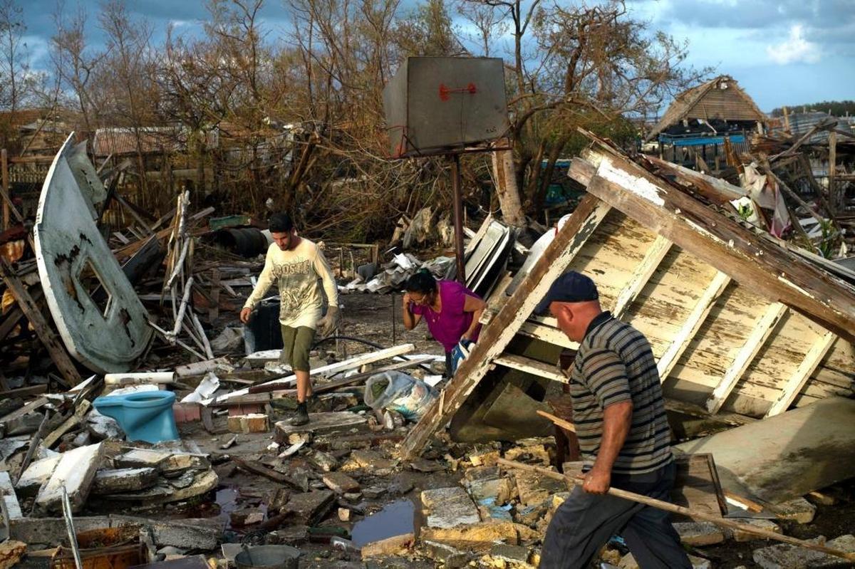 Cubans try to save their belongings in their destroyed house in Isabela de Sagua, Cuba, on Sept. 11, 2017 after the passage of Hurricane Irma.