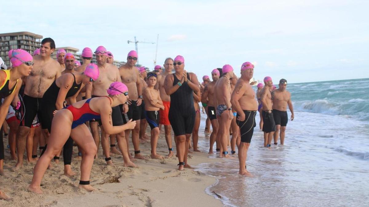 Swimmers get ready to rush the North Beach water at Swim Miami Beach on Saturday, Oct. 17, 2015.