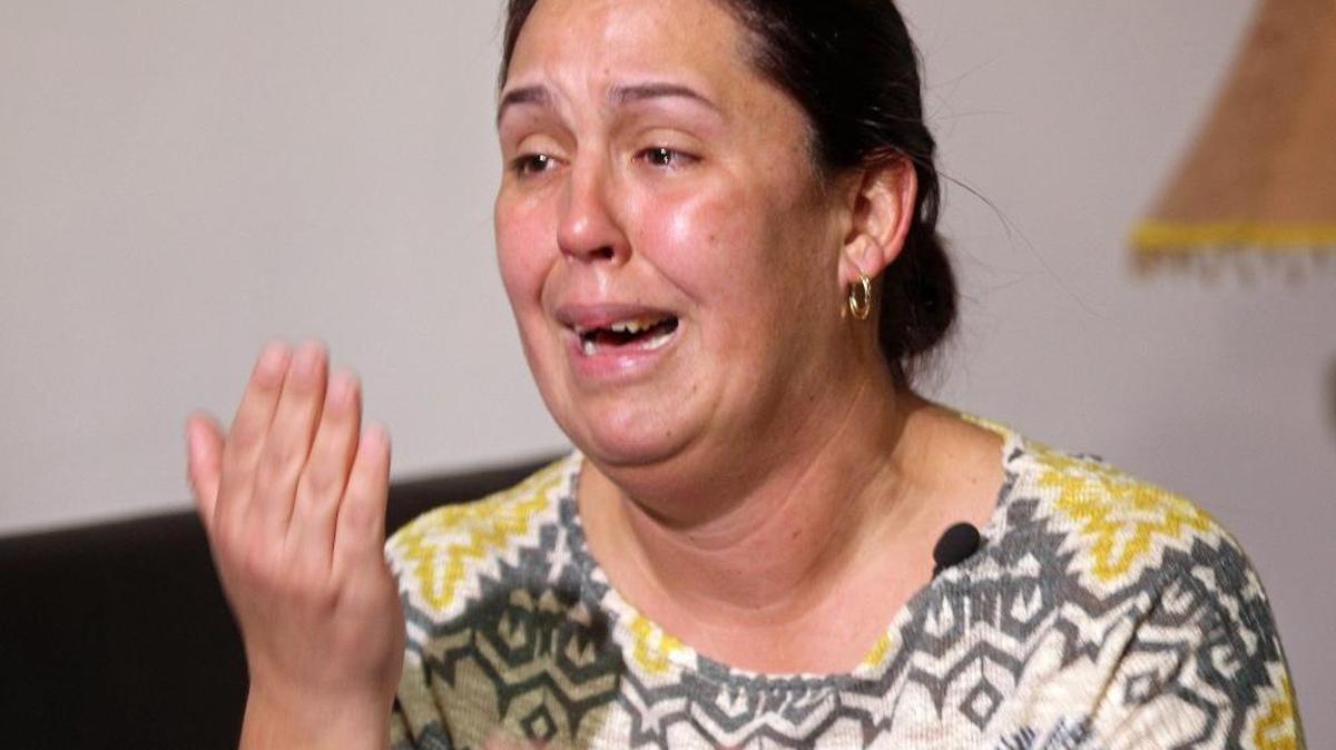 Geydi Caraballo cries as she explains her parents’ ordeal upon arriving in the United States from Cuba. They have been separated and detained.