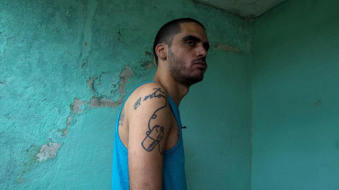 Danilo Maldonado, better known as El Sexto, stands at the entrance of his home after being released from jail, in Havana, Cuba, in October of 2015. Maldonado was freed after 10 months behind bars for attempting to release two pigs painted with the names of Raúl and Fidel Castro.