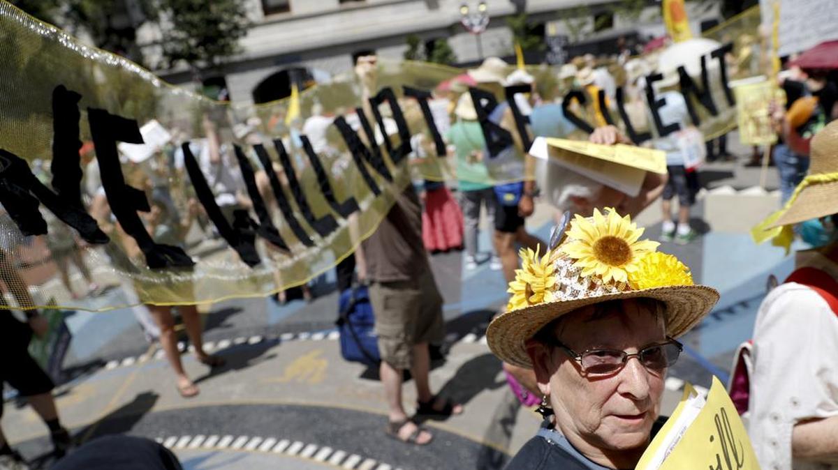 Environmental protesters arrive for a demonstrators at Dillworth Park on Sunday, July 24, 2016, in Philadelphia. The Democratic National Convention starts Monday in Philadelphia.