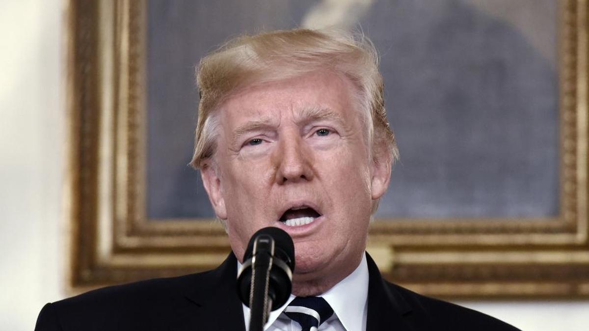 President Donald Trump makes a statement on the mass shooting at an outdoor concert in Las Vegas in the diplomatic room of the White House in Washington, DC, October 2, 2017. More than 50 people were killed Sunday night when a gunman opened fire into a country music festival on the Las Vegas Strip.