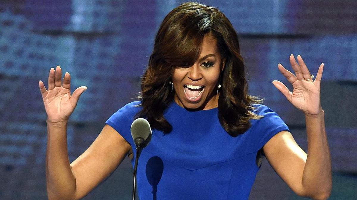 Michelle Obama waves to delegates at the Democratic National Convention on Monday