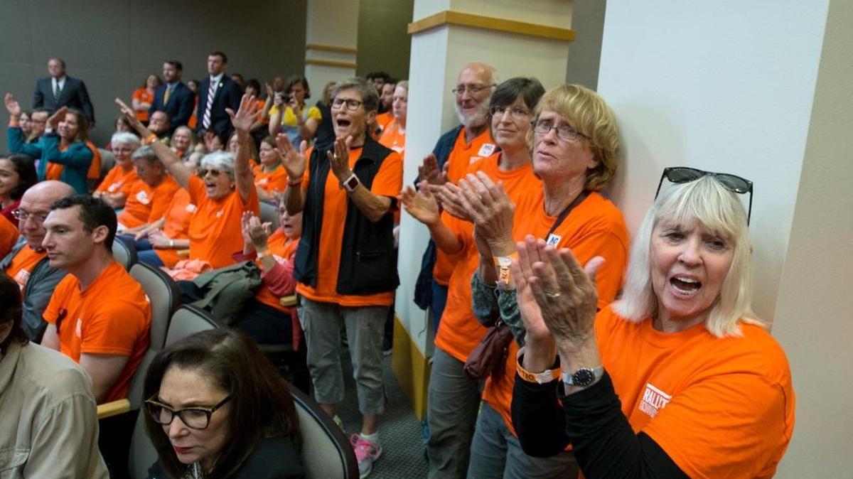 Protesters react to a speaker in the Senate Rules Committee meeting on gun safety in the Knott Building at the Florida Capitol after the Rally in Tally on Monday in Tallahassee.