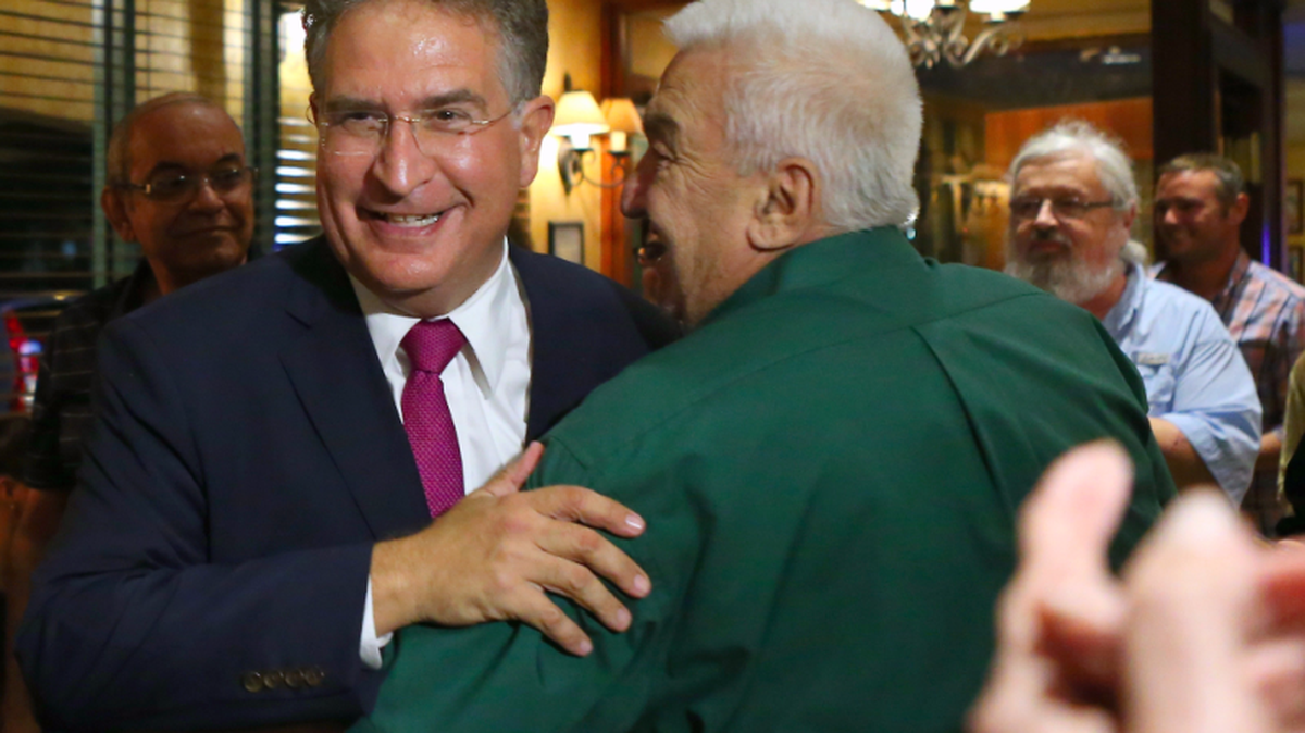 Joe Garcia, left, is a former Democratic congressman running to re-gain his seat.