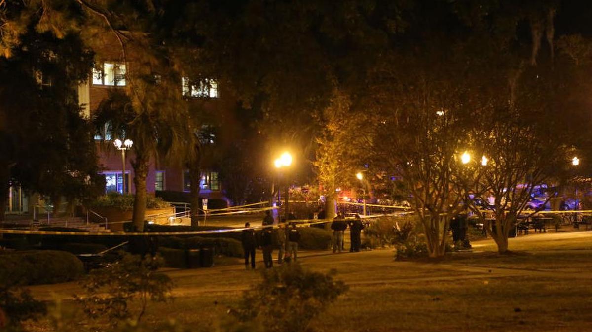 Police investigate a shooting scene at Strozier Library on Florida State campus on Nov. 20, 2014, in Tallahassee.