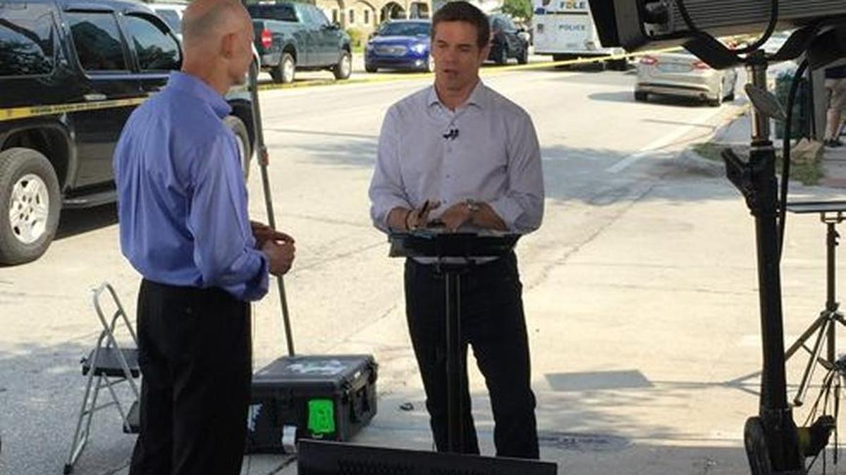 Gov. Rick Scott speaks to FoxTV reporter Bill Hemmer in Orlando near the site of the Pulse shootings.