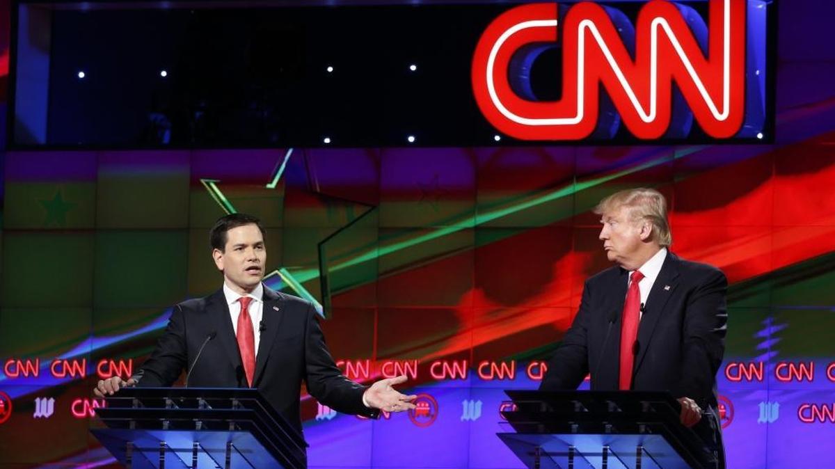 FILE - In this March 10, 2016, file photo, Republican presidential candidate, Sen. Marco Rubio, R-Fla., speaks, as Republican presidential candidate Donald Trump, listens, during the Republican presidential debate in Coral Gables, Fla.