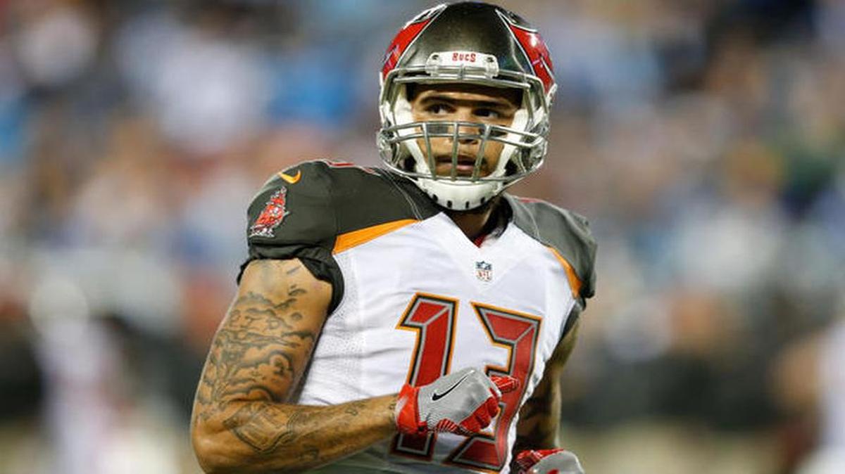 Tampa Bay Buccaneers wide receive Mike Evans sat during the national anthem before Sunday’s game against the Chicago Bears.