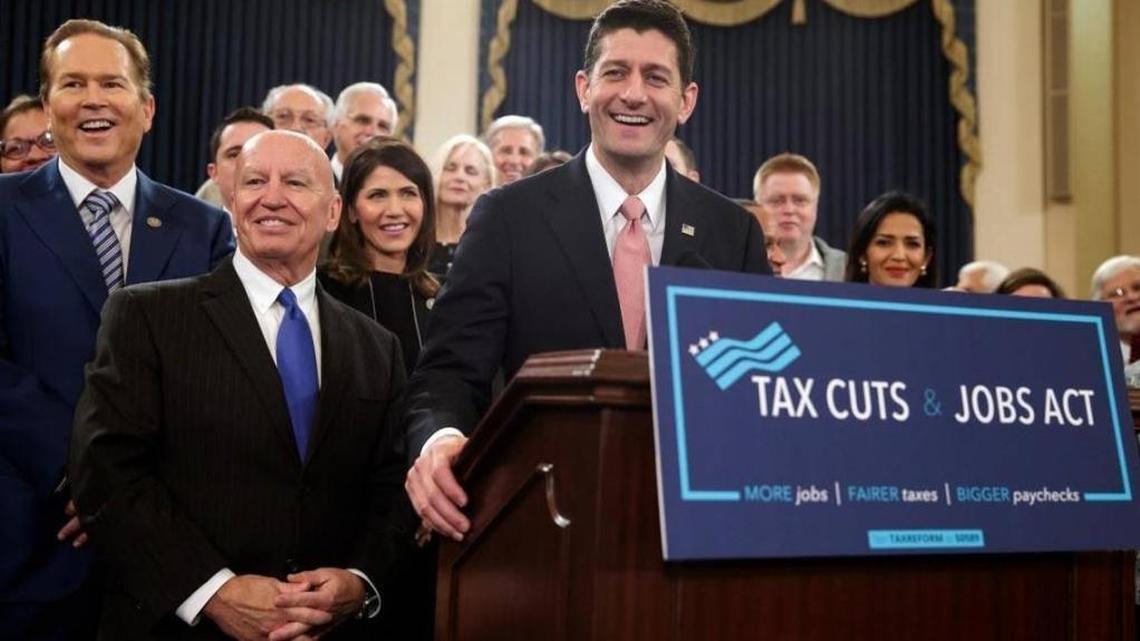 Speaker of the House Paul Ryan, R-Wis., joined by, from left, Rep. Vern Buchanan, R-Fla., House Ways and Means Committee Chairman Kevin Brady, R-Texas, and Rep. Kristi Noem, R-S.D., smiles as they unveil the GOP's far-reaching tax overhaul, the first major revamp of the tax system in three decades, on Capitol Hill in Washington, Thursday, Nov. 2, 2017.