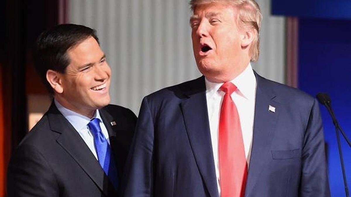 Republican Sen. Marco Rubio speaks with then- presidential candidate Donald Trump during a debate break at Fox Business Network in January 2016.