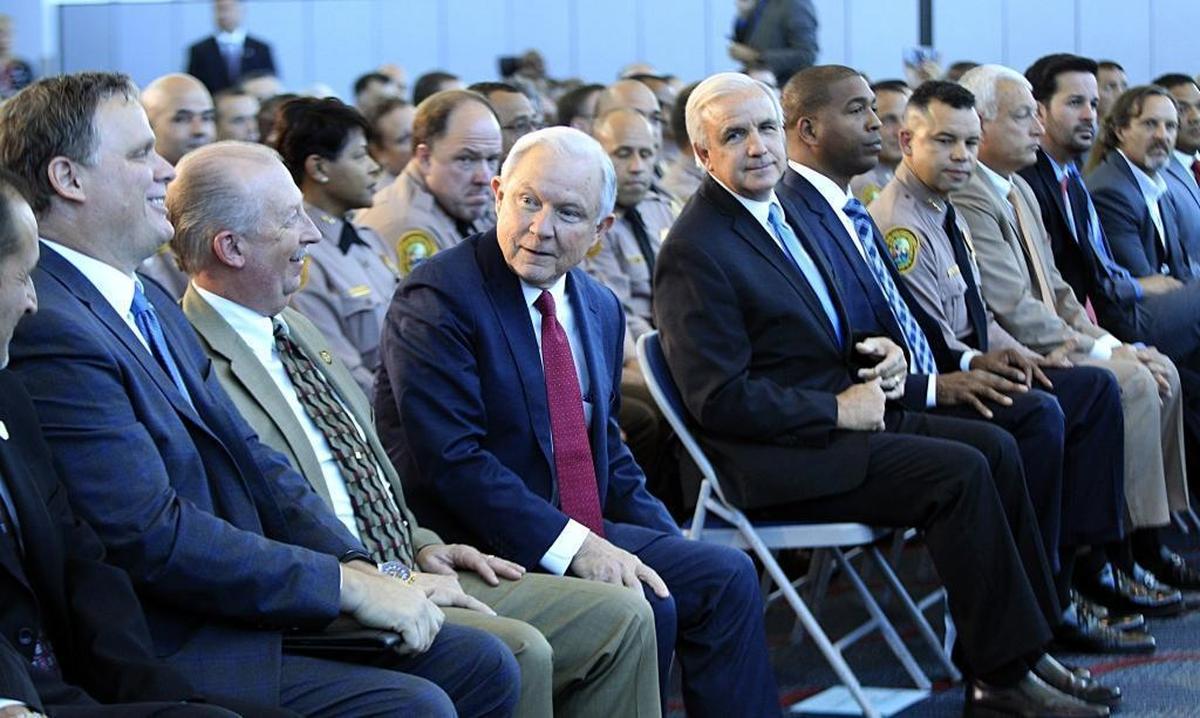Miami Dade County Mayor Carlos Gimenez, right, joined U.S. Attorney General Jeff Sessions, who talked about the growing trend of violent crime in sanctuary cities highlighting jurisdictions like Miami-Dade that have increased their cooperation and information sharing with federal immigration authorities. Sessions attended a conference at Port of Miami Terminal E, on Wednesday, Aug. 16, 2017.