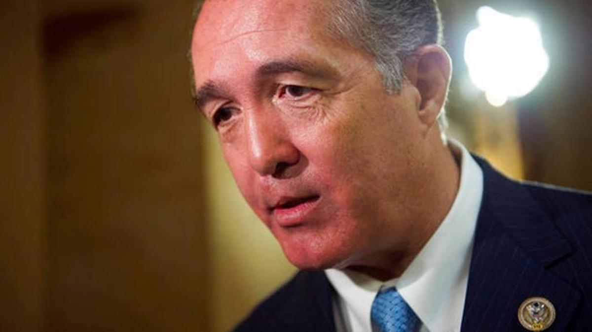 Rep. Trent Franks, R-Ariz. speaks with a reporter on Capitol Hill in Washington. Franks says he is resigning Jan. 31 amid a House Ethics Committee investigation of possible sexual harassment. Franks says in a statement that he never physically intimidated, coerced or attempted to have any sexual contact with any member of his congressional staff. Instead, he says, the dispute resulted from a discussion of surrogacy.