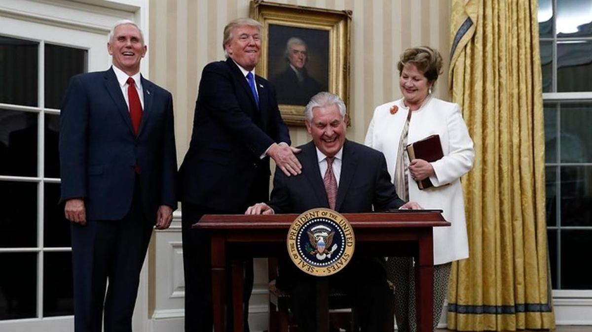 Vice President Mike Pence, President Donald Trump at Secretary of State Rex Tillerson’s swearing in day back in February. Tillerson’s wife, Renda, watches the hijinks.