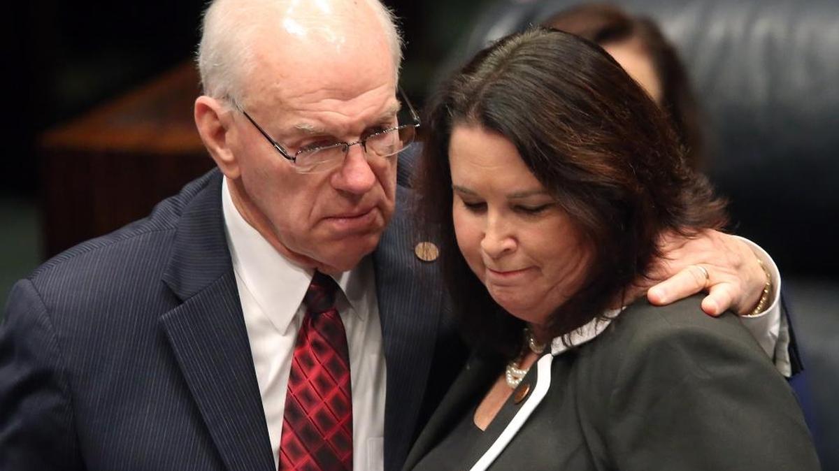In this March 9, 2016, file photo, Sen. Alan Hays, R-Umatilla, left, congratulates Sen. Kelli Stargel, R-Lakeland, after Stargel's bill to limit abortions in Florida passed the Senate in Tallahassee, Fla. A federal judge on Thursday, Aug. 18, definitively blocked the Florida abortion law to prevent state funds from going to organizations that provide abortions. The sweeping law also was designed to greatly increase inspection requirements for abortion clinics. Planned Parenthood challenged three parts of the law.