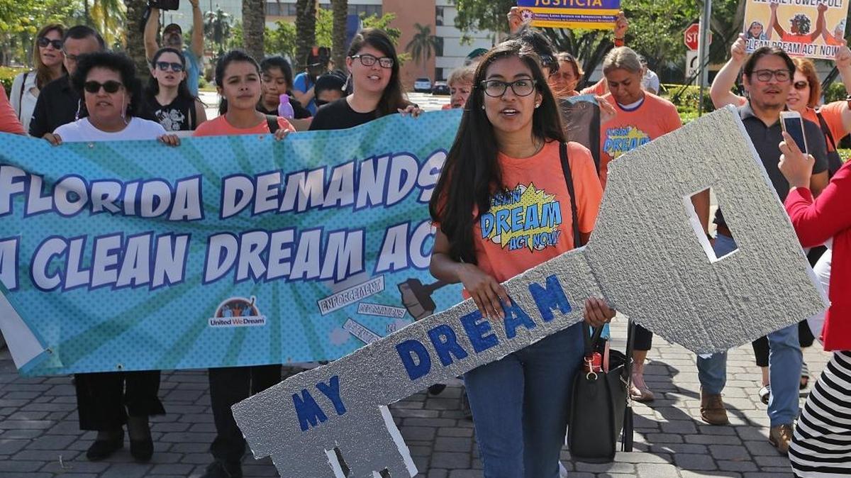Nery Lopez, a DACA recipient, right, carries the ‘Dream Key’ as she leads supporters of Dreamers, made up immigrant youths, mothers and community members from United We Dream, We Belong Together, Students Working for Equal Rights (SWER), Florida Immigrant Coalition (FLIC), We Count!, Women Working Together, Friends of Miami-Dade Detainees, and Florida Student Power Network marched up to the front doors of Senator Rubio’s district office in Doral, but were denied access due to the government shutdown and Sen. Rubio’s presence in Washington, D.C., for the end of the government shutdown on Monday, Jan. 22, 2018.