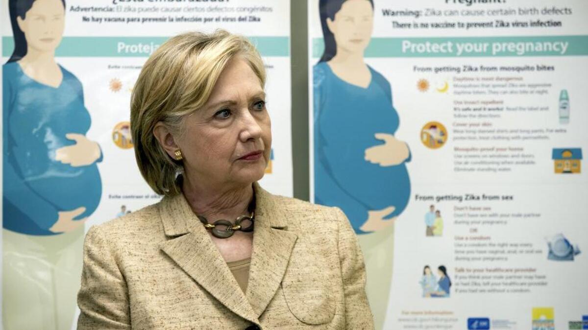 Informational Zika posters for pregnant women were displayed behind Democratic presidential nominee Hillary Clinton when she toured the Borinquen Health Care Center in Miami.