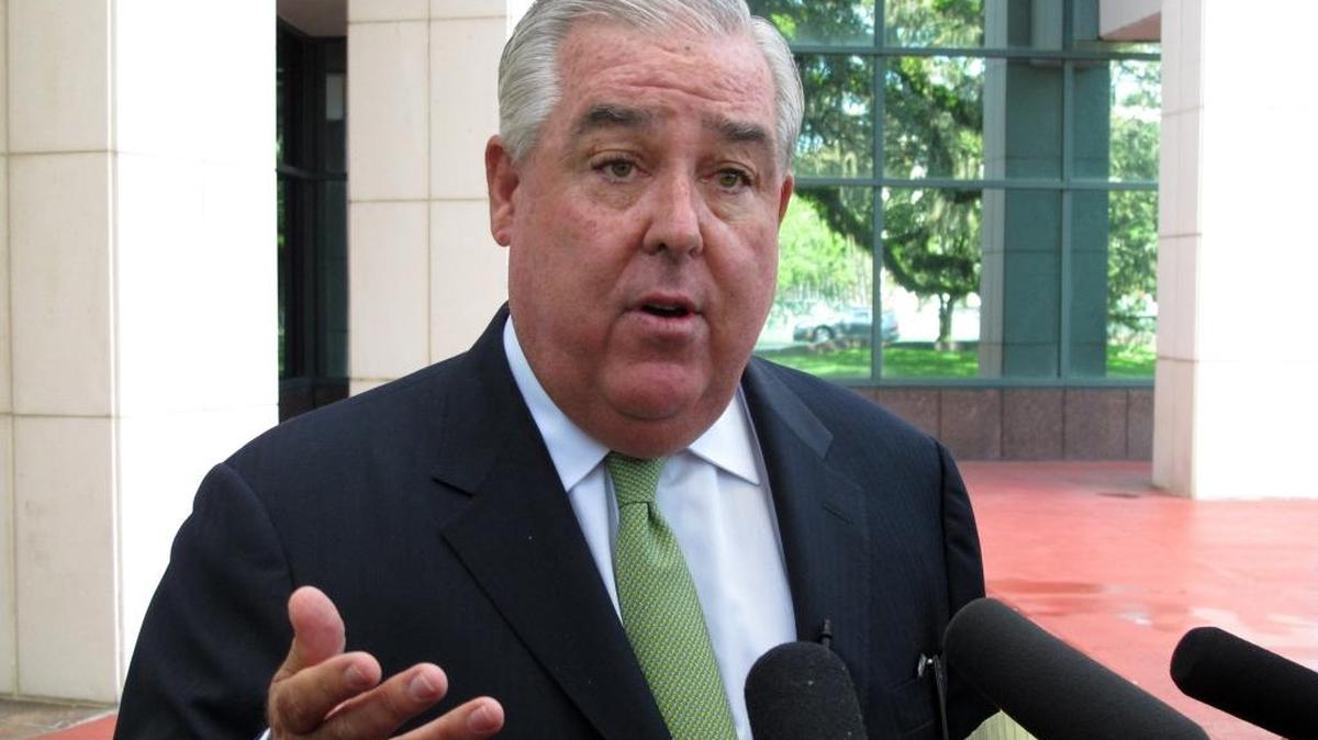 John Morgan discusses a lawsuit he filed challenging the state’s ban on smokable medical marijuana in July outside the Leon County courthouse in Tallahassee.
