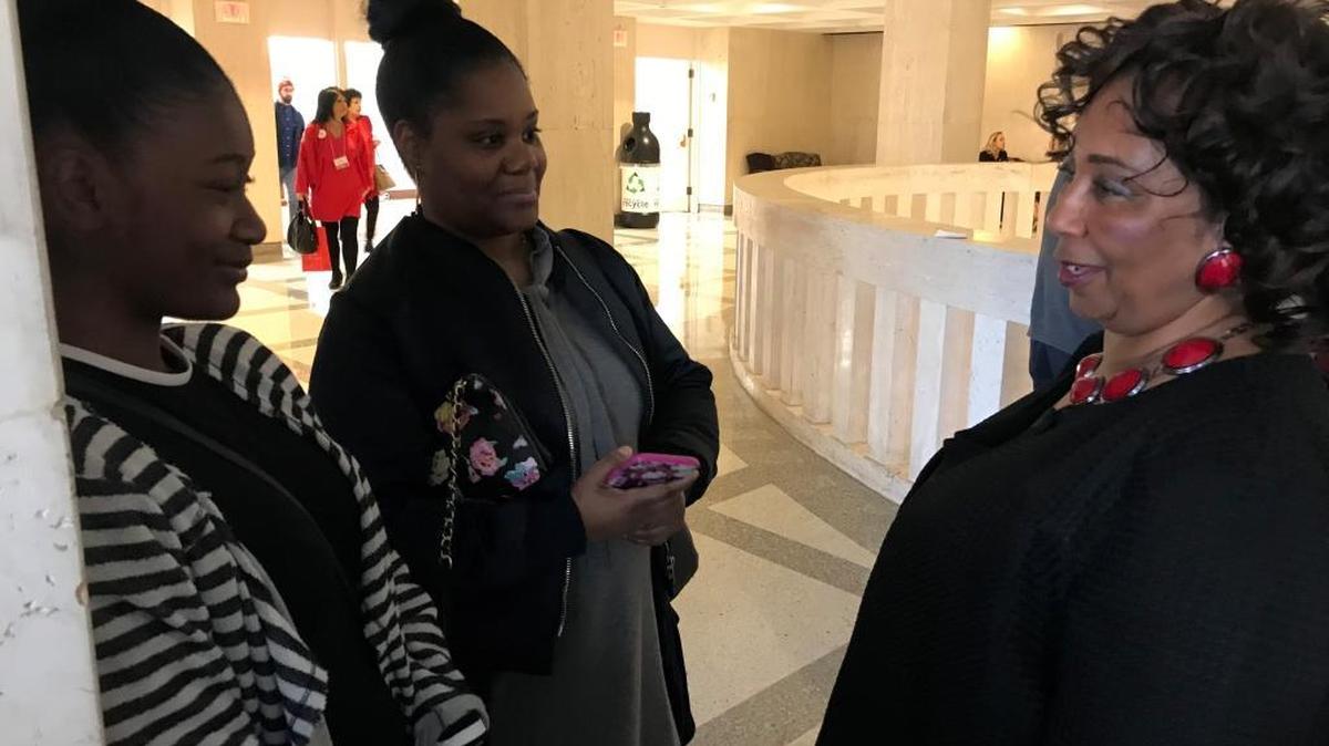 Sherry Johnson talks with her daughter Tolonda Tolbert, 42, and granddaughter Danielle Wiggins, 16, after legislation that would ban marriage under the age of 18 passed the Senate unanimously Wednesday.