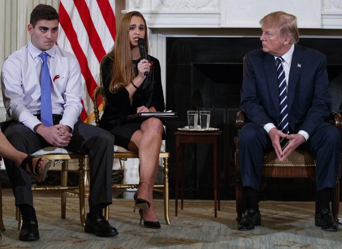 President Donald Trump, who participated in a listening session with high school students Wednesday, including Jonathan Blank (left) and Julia Cordover of Marjory Stoneman Douglas High School, has called for trained teachers or others in schools to carry guns as a deterrent to attacks.
