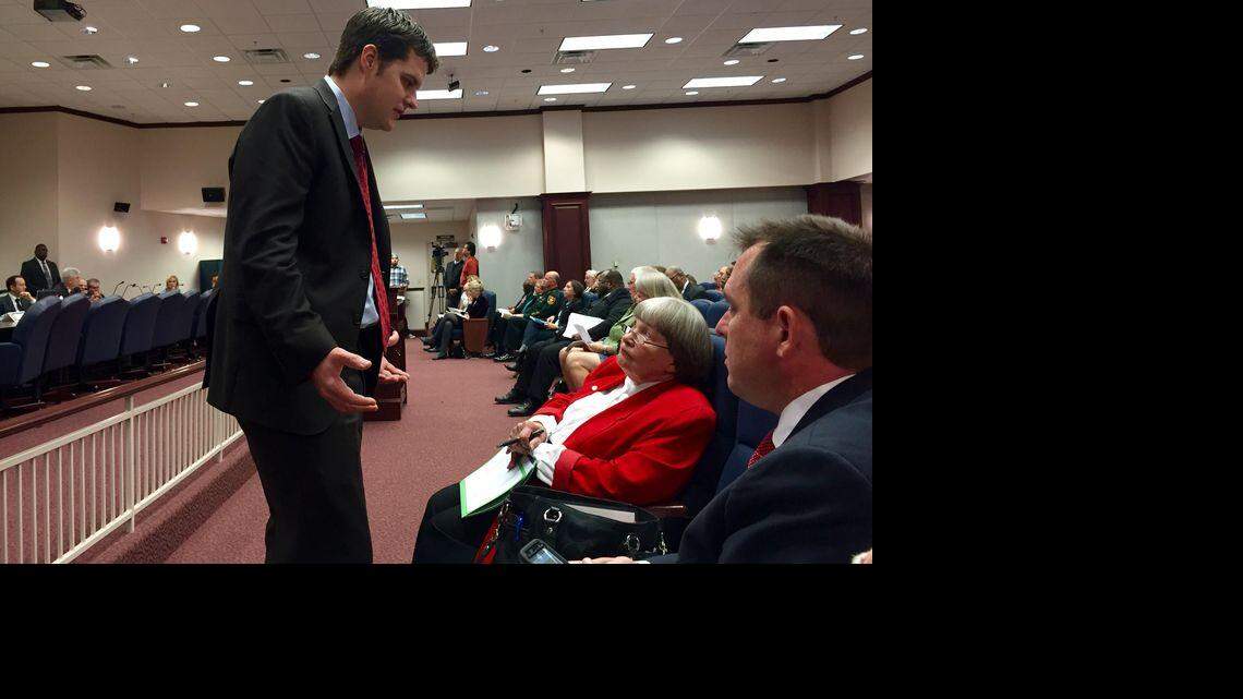 State Rep. Matt Gaetz, R-Fort Walton Beach, left, confers with gun-rights lobbyists — Marion Hammer, the National Rifle Association’s longtime Tallahassee representative, and Florida Carry’s attorney Eric Friday — about a late-filed amendment proposed to Gaetz’s open-carry gun legislation on Thursday, Jan. 28, 2016, during a meeting of the House Judiciary Committee. Kristen M. Clark / Herald/Times Tallahassee bureau