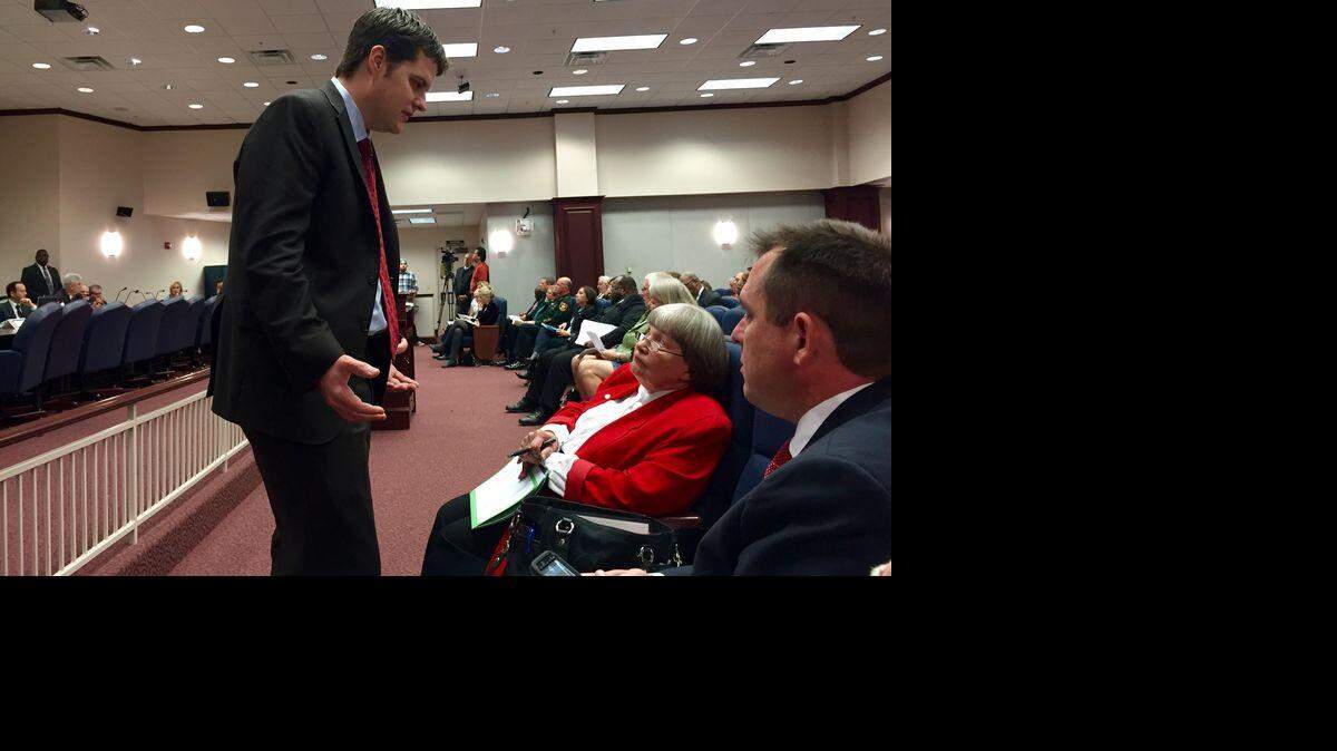 State Rep. Matt Gaetz, R-Fort Walton Beach, left, confers with gun-rights lobbyists — Marion Hammer, the National Rifle Association’s longtime Tallahassee representative, and Florida Carry’s attorney Eric Friday — about a late-filed amendment proposed to Gaetz’s open-carry gun legislation on Thursday, Jan. 28, 2016, during a meeting of the House Judiciary Committee. Kristen M. Clark / Herald/Times Tallahassee bureau