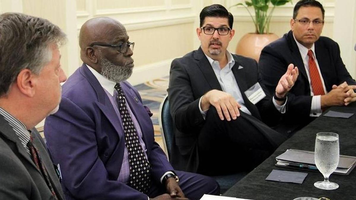 Republican state Rep. Manny Diaz Jr., center, speaks during a panel discussion about educational choice, sponsored by the James Madison Institute, on May 3, 2016, in Miami.
