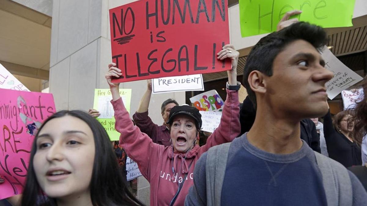 FILE PHOTO: Protester Joan Wynne, center, chants anti-Trump and anti-Gimenez slogans in downtown Miami on Jan. 31 during a protest over Miami-Dade Mayor Carlos Gimenez's controversial order assuring the Trump administration that Miami-Dade is not functioning as a sanctuary city for illegal immigrants.
